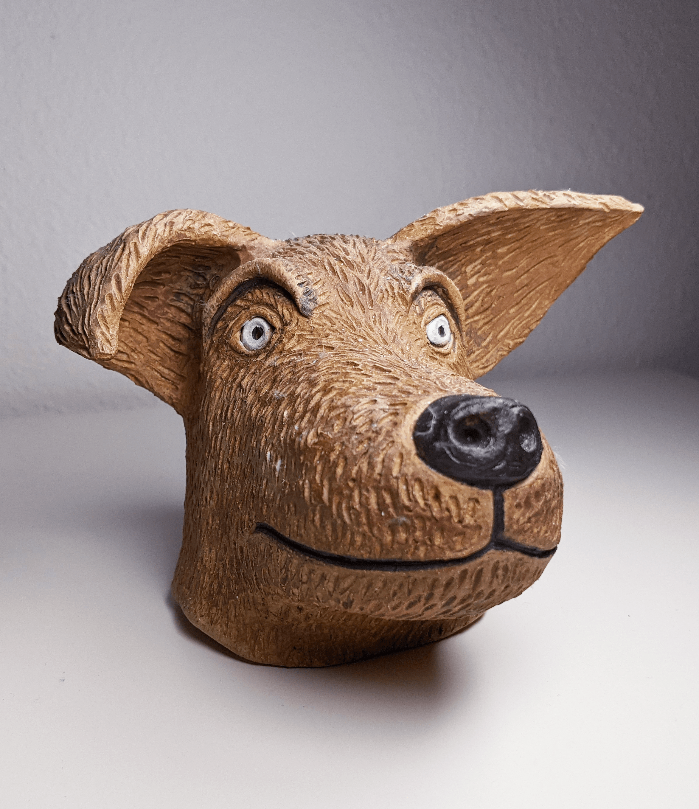 Small clay sculpture of a dog