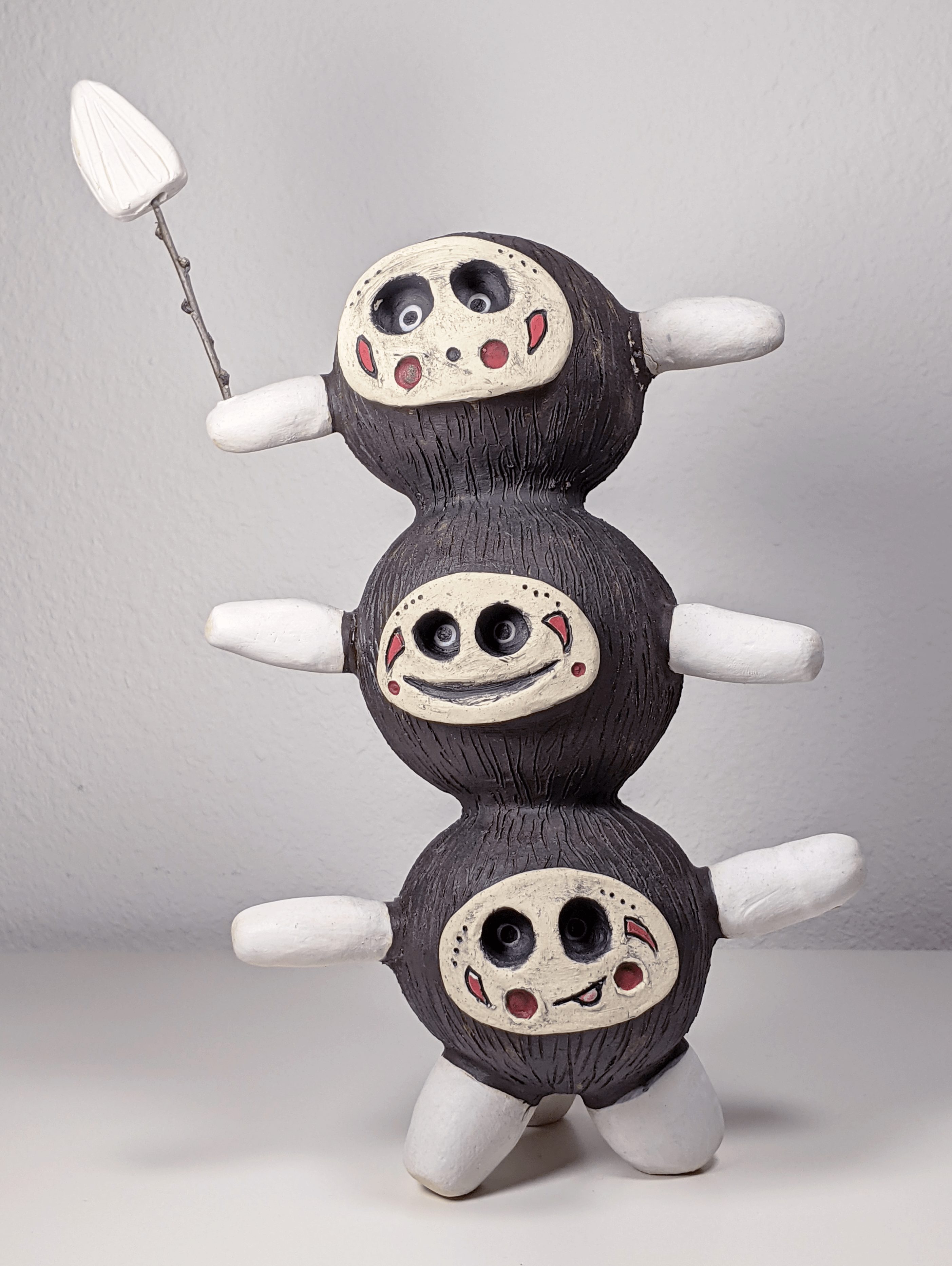 Small sculpture of a tiny tribal warrior creatures