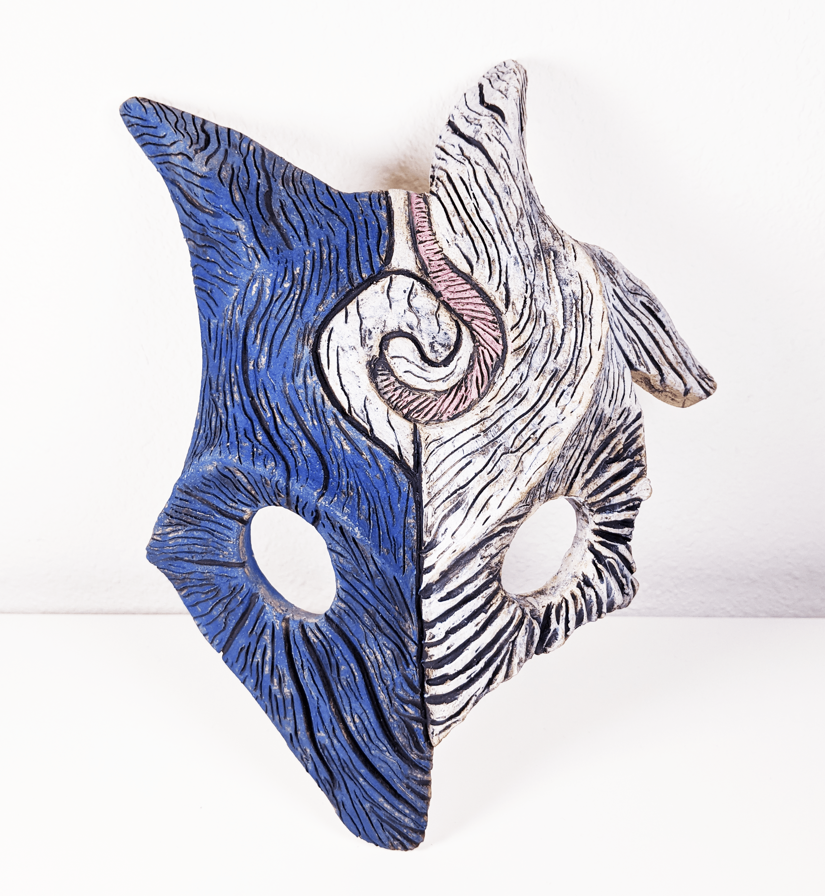 Small clay sculpture of a Kindred mask