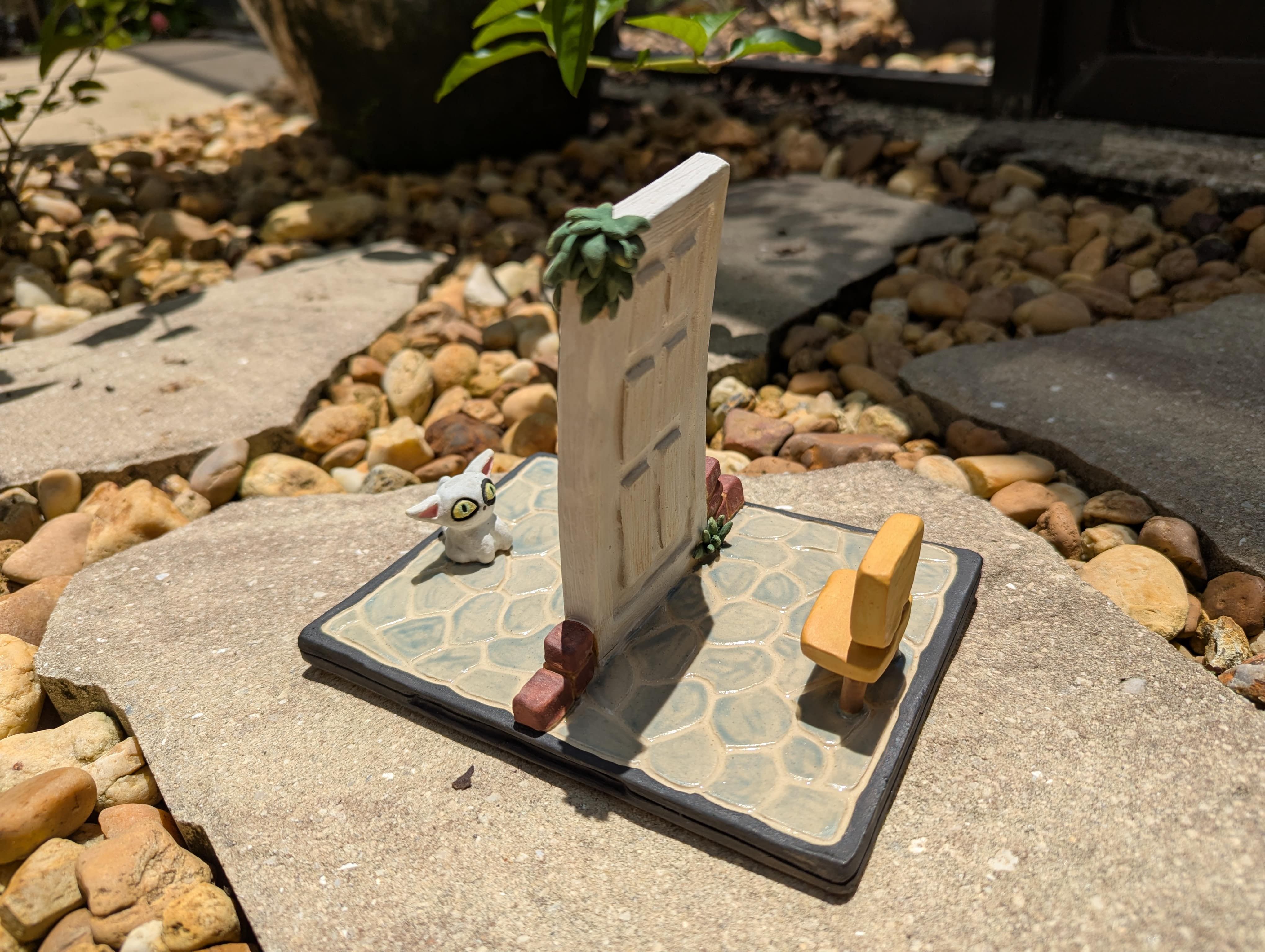 Suzume figure made from clay